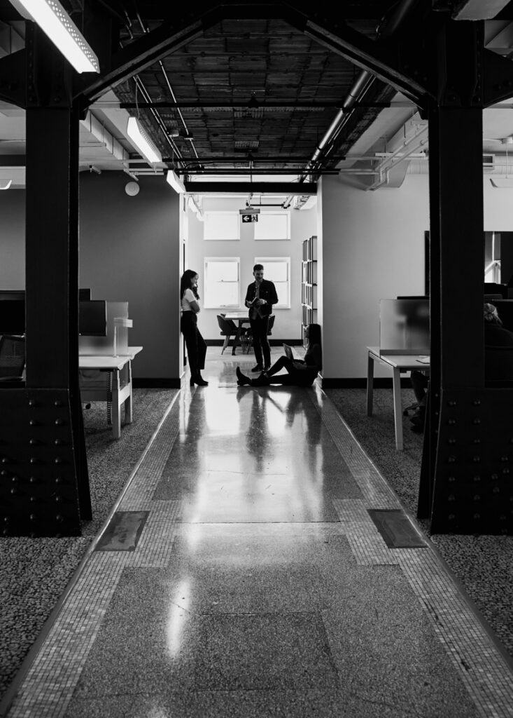 Employees talking in hallway
