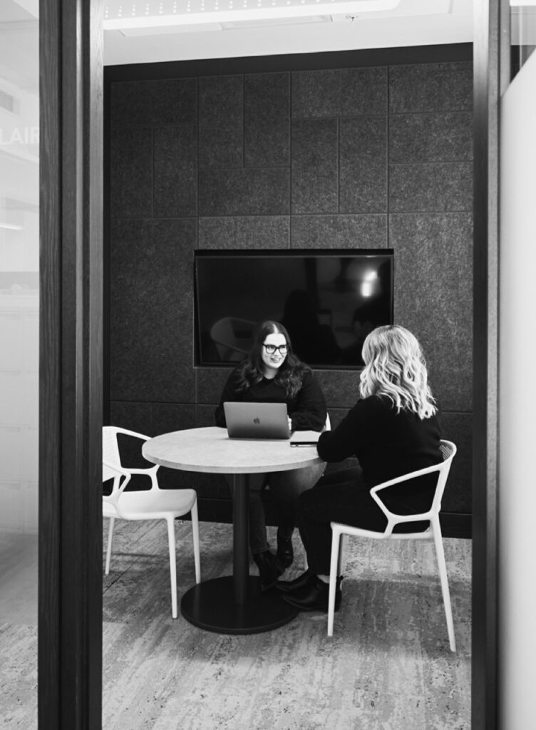 Women at table strategizing