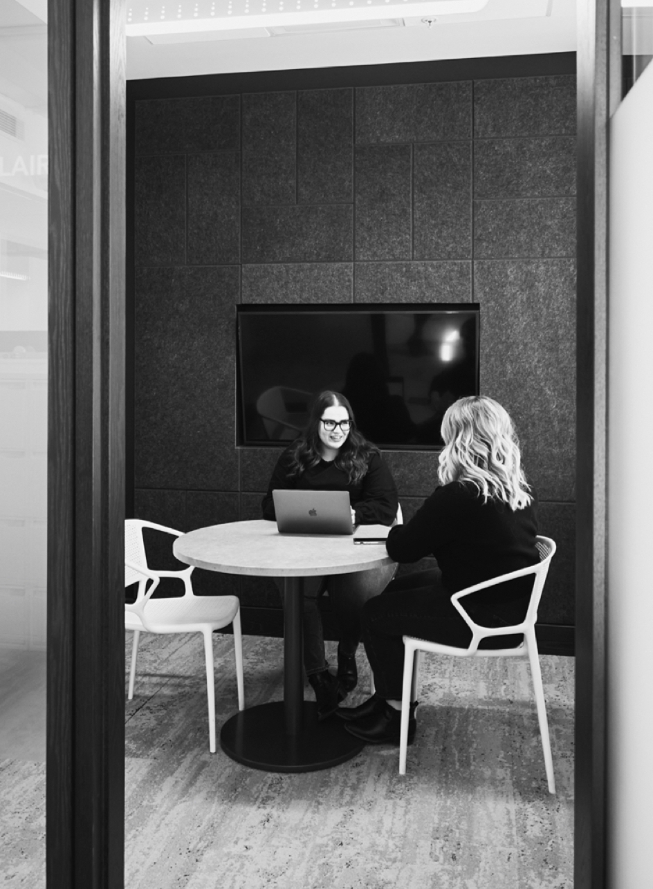 Women strategizing at table