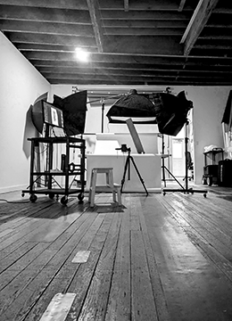Photo studio setup with professional lights and camera